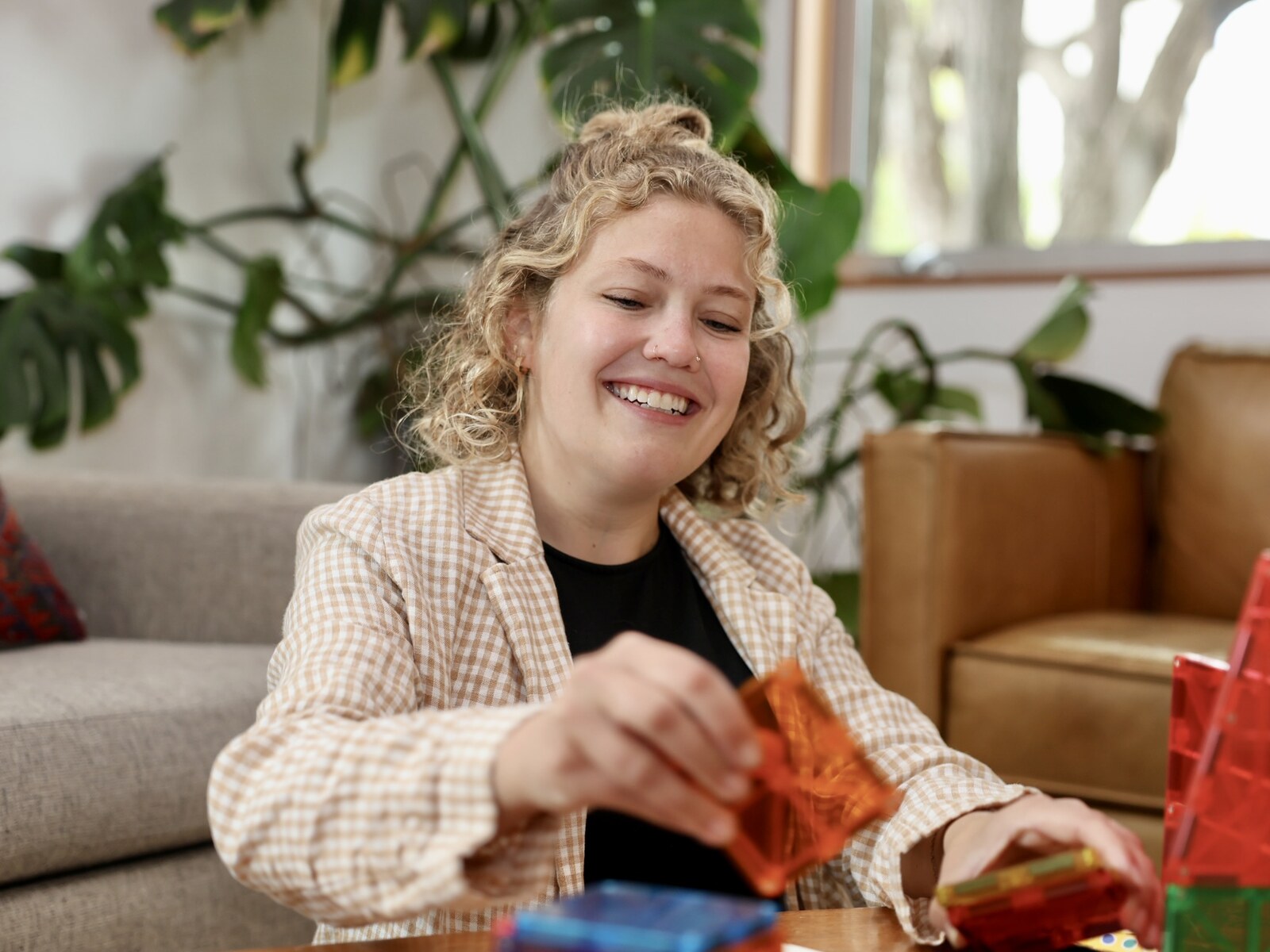 Jen working with magnetic tiles during a home session
